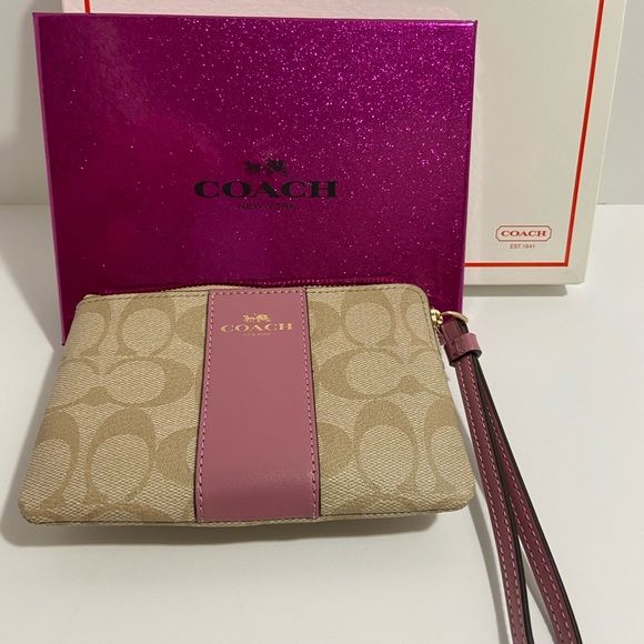 COACH WRISTLET WITH C-SIGNATURE COACH ON IT AND WITH A PINK STRIPE ON FRONT. - Picture 5 of 8